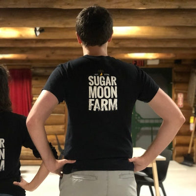Unisex, short sleeved t-shirt with Sugar Moon Farm logo on back. From Sugar Moon Farm - A Canadian maple syrup farm located in Nova Scotia, Canada. Offering maple syrup, maple butter, maple syrup on snow and a restaurant. Put on your hiking boots and hike the Rogart Mountain trail then sit down for some fluffy pancakes made from our fluffy pancake recipe and Canadian maple syrup.